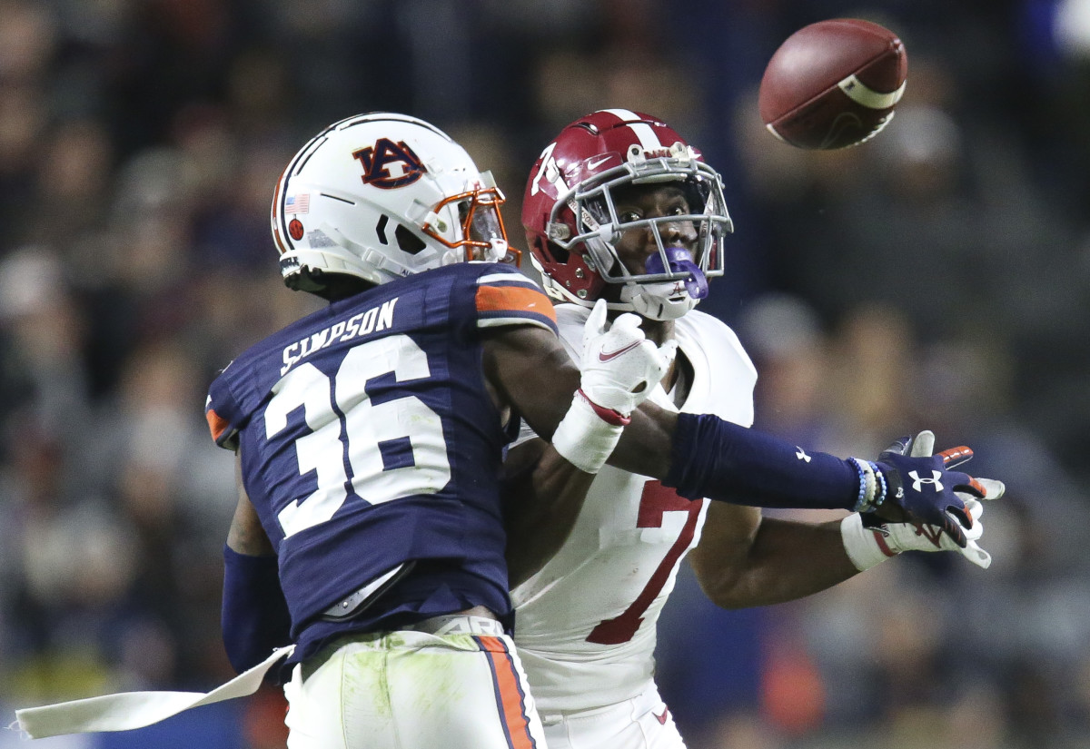 Nov 27, 2021; Auburn, Alabama, USA; Auburn Tigers defensive back Jaylin Simpson (36) breaks up a pass intended for Alabama Crimson Tide wide receiver Ja'Corey Brooks (7) at Jordan-Hare Stadium. Alabama defeated Auburn in four overtimes. Mandatory Credit: Gary Cosby Jr.-USA TODAY Sports